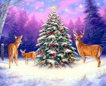 Семья оленей возле новогодней елки